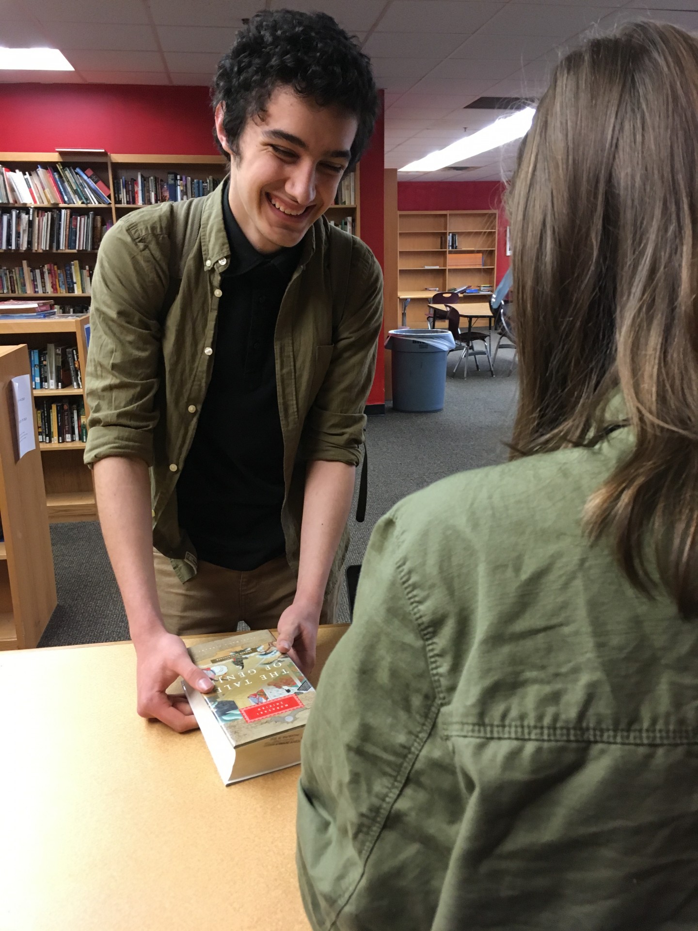 Pablo S. checking out a book during our soft opening.