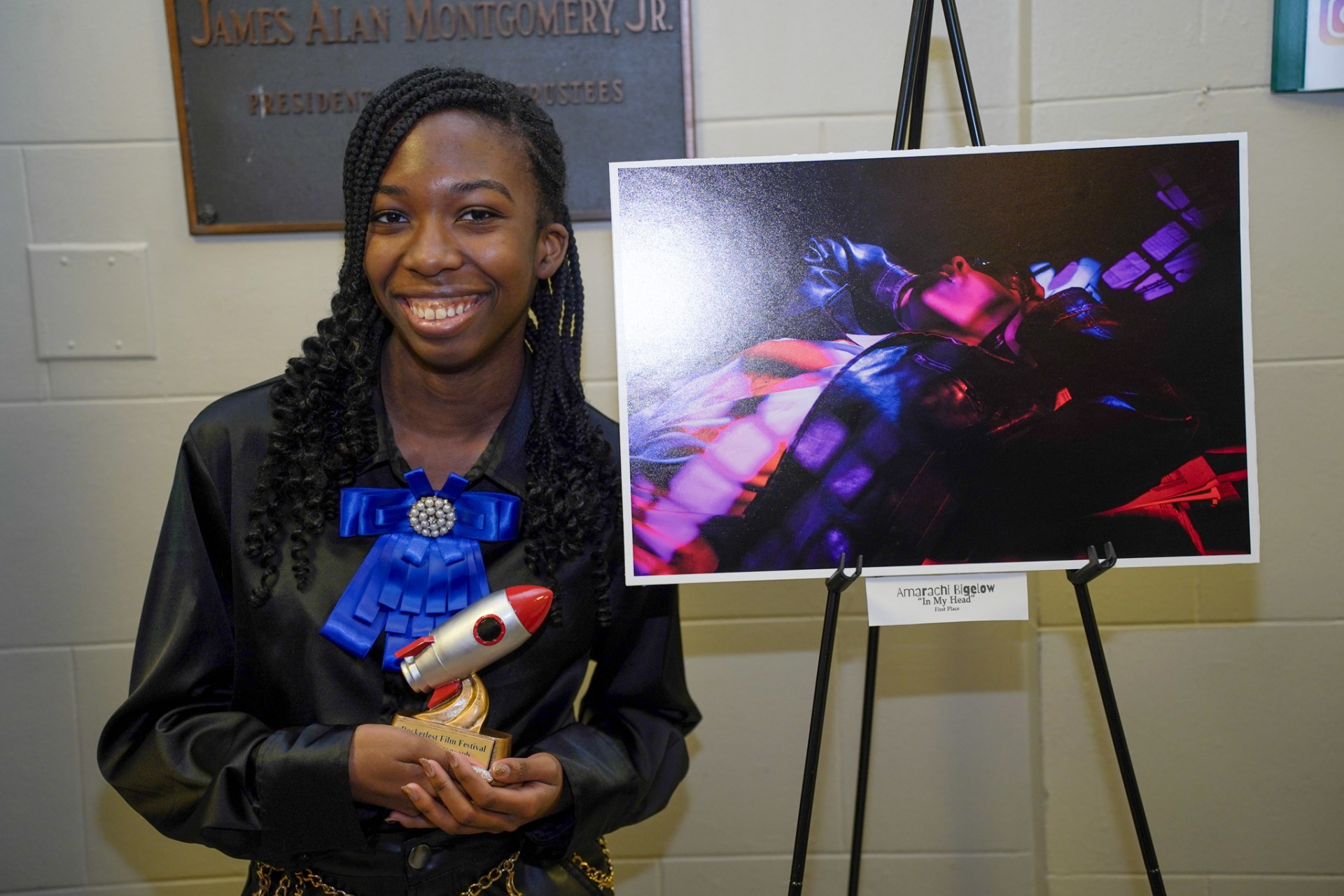Our first place photography winner with their trophy and photo!