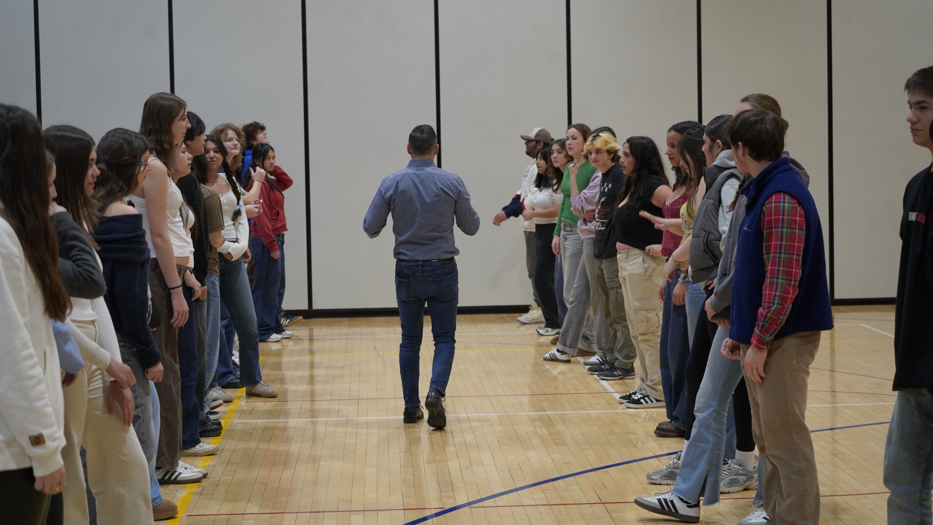Mike Andino, owner of Estilo Dance Studio getting ready to teach partner work to the students.